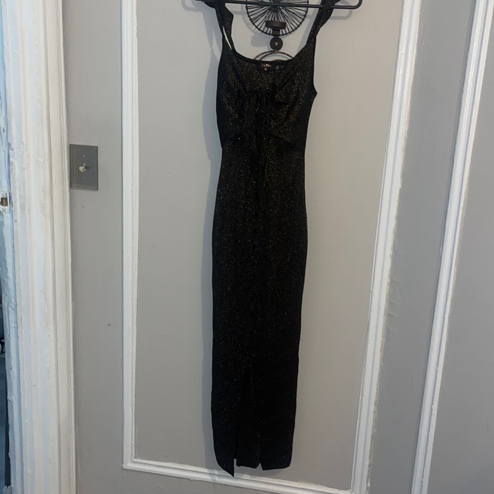 Black and gold midi dress with a peep in the front and slit infront.